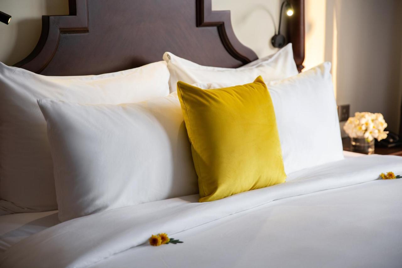 Mulberry Collection Silk Village Hoi An Dış mekan fotoğraf A bed with pillows